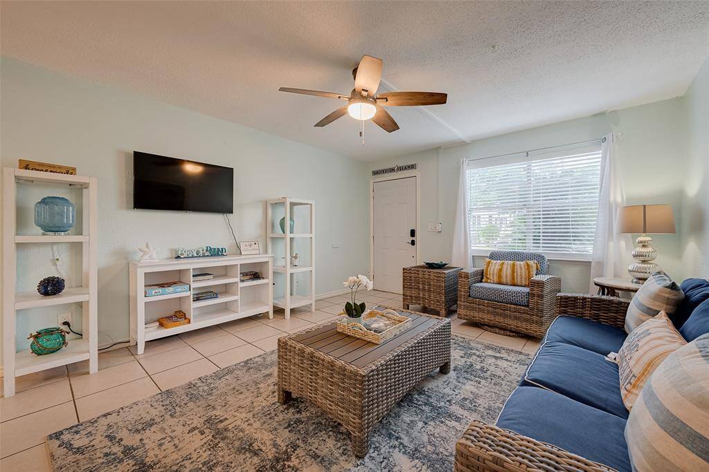 A soft, neutral color scheme with hints of pastel turquoise subtly nods to the coastal lifestyle.