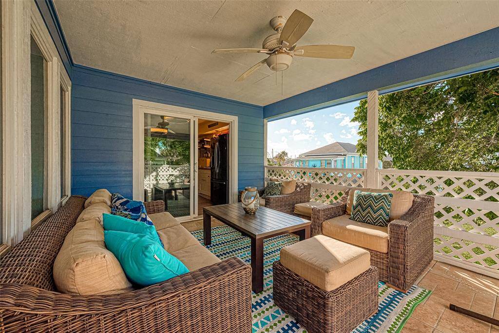 A breezy, well-sized space with a ceiling fan for added comfort, the balcony in the upstairs unit is conveniently accessible from the kitchen through sliding glass doors.