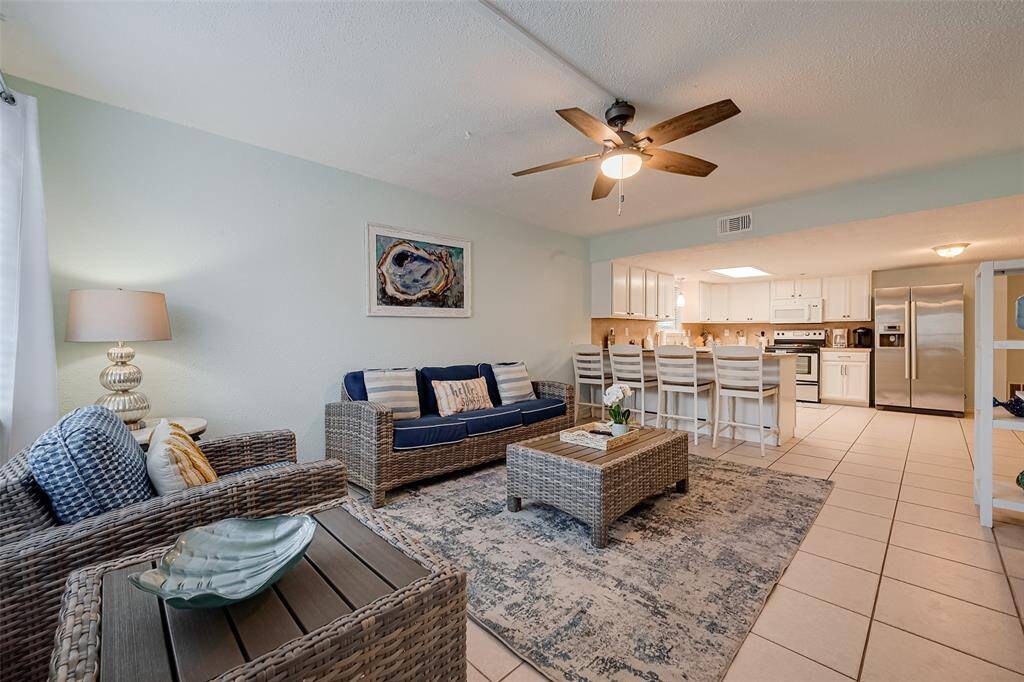 This open-concept area allows for easy movement between the living and kitchen spaces, enhancing functionality.