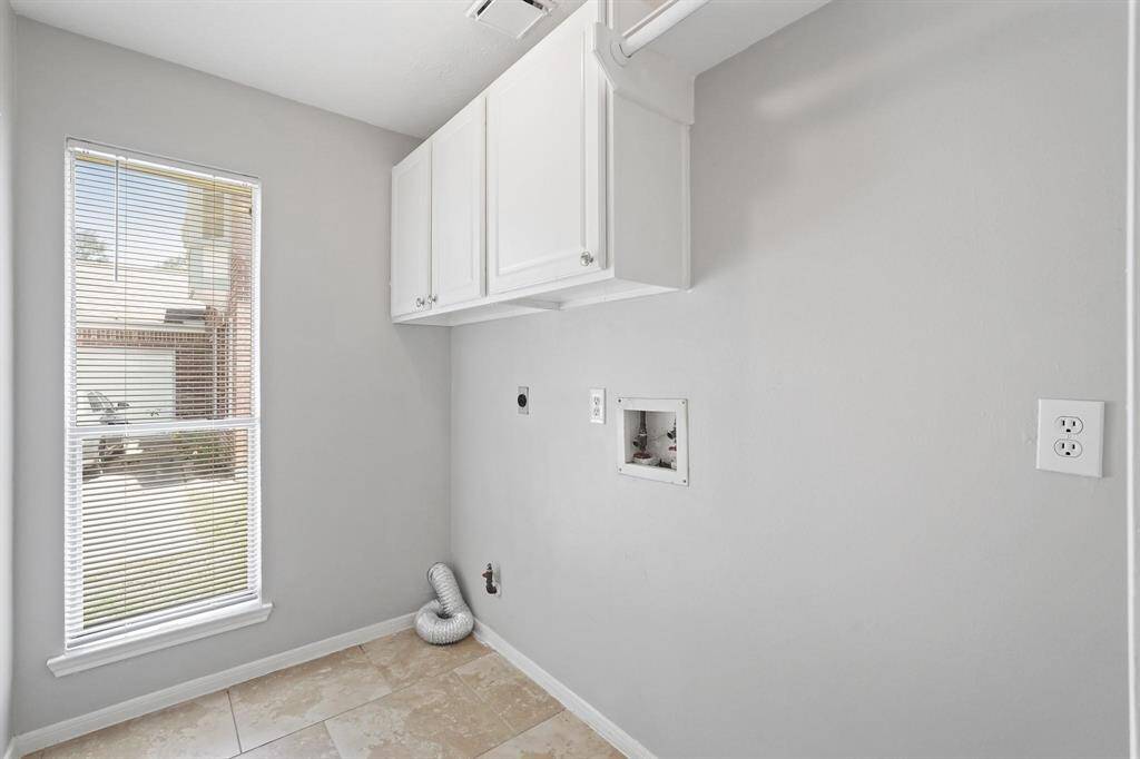 Laundry Room with Gas & Electric for Dryer. Extra Storage and 2nd Fridge Space if wanted. Natural Lighting in Laundry Room is always a plus!
