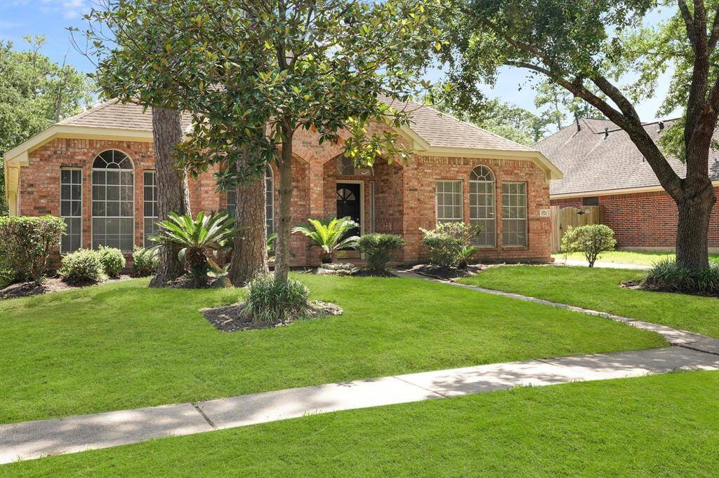 Beautiful mature trees and much natural lighting inside! Some of the grass has been digitally enhanced.