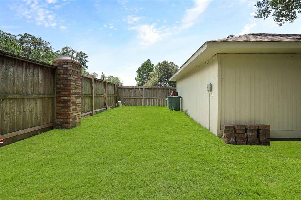 More room behind the Garage for some outdoor activities. Grass is digitally enhanced.
