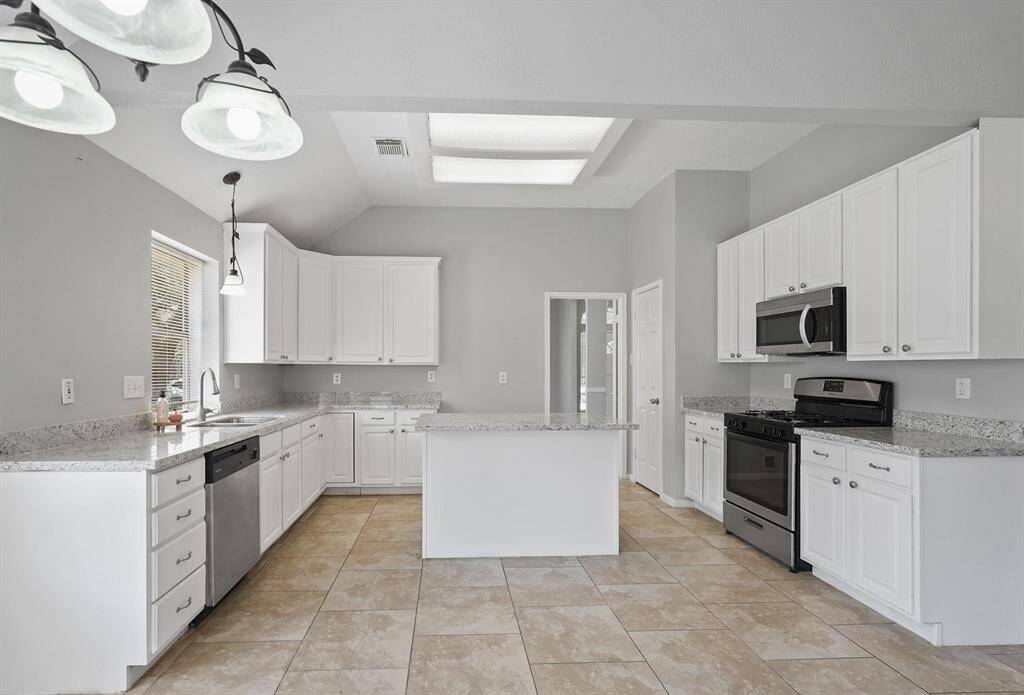 Enjoy all the Cabinetry, Roomy Granite Countertops, Newer Appliances, Turntable corner lower Cabinet, and beautiful Neutral Tones!