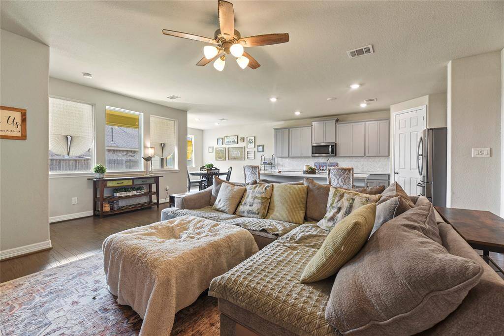 Enjoy entertaining your guests while you are cooking in this open concept kitchen and family room combination. Perfect for gatherings.