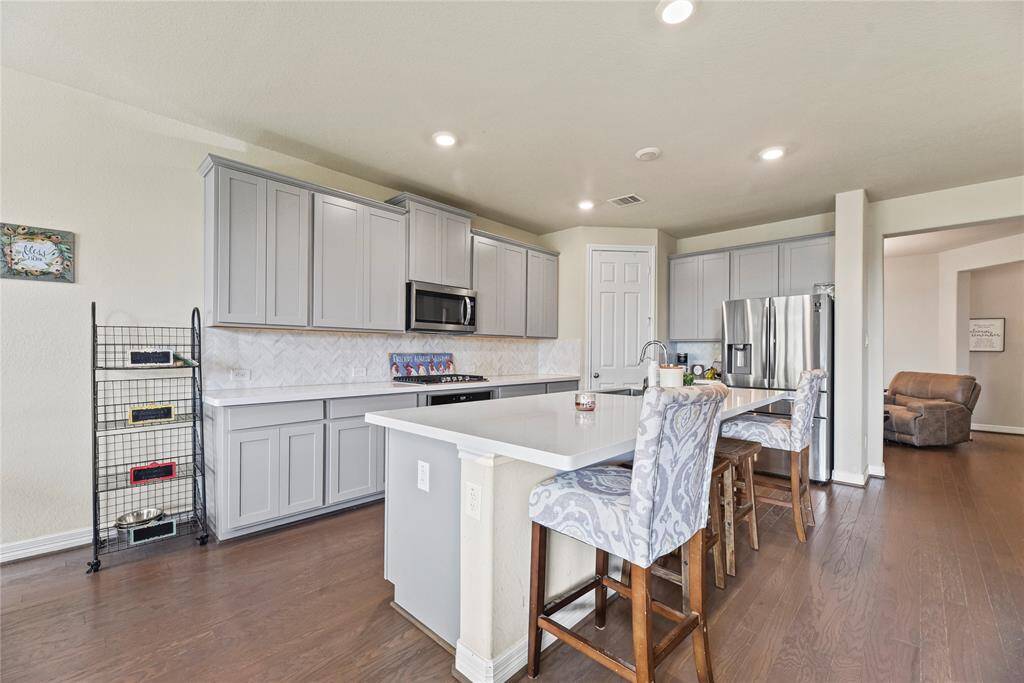 The island can seat four people comfortably while you are cooking for your family and/or guests.