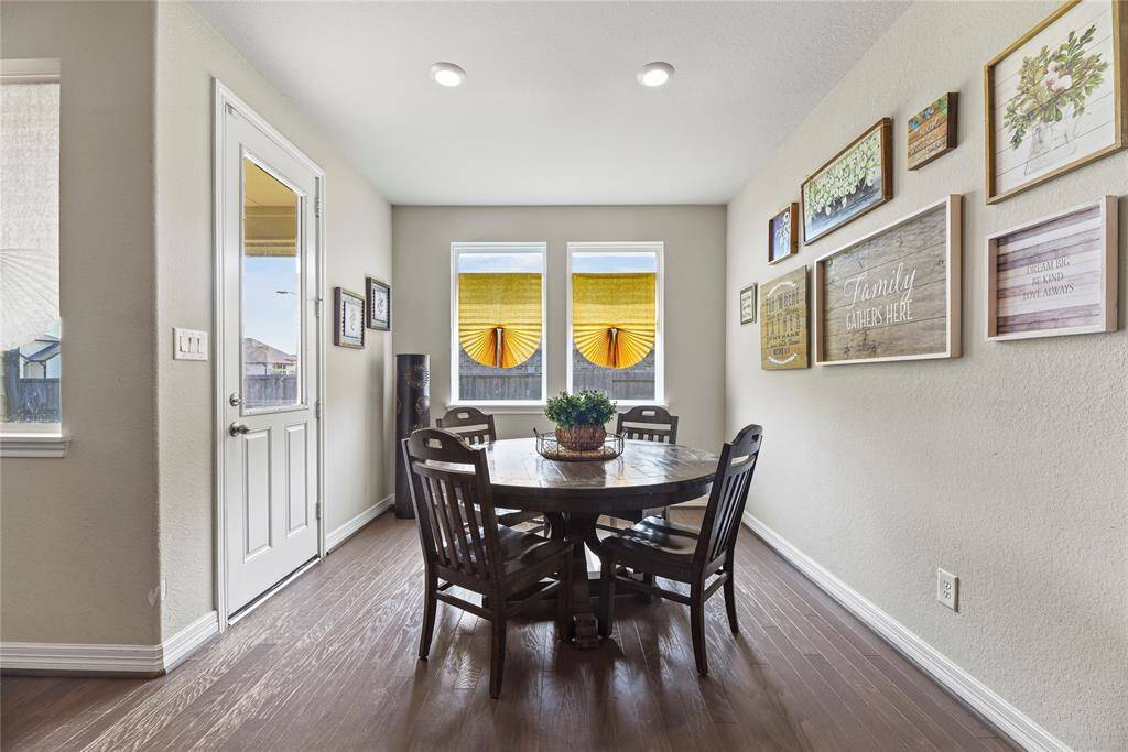 Off to the kitchen is the breakfast area or casual dining space with lots of natural light and access to the backyard. This space can fit long dining table to host large gatherings.