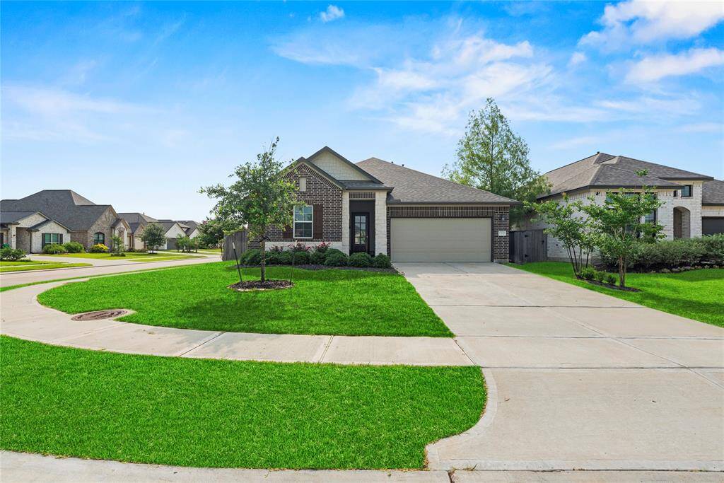 You'll enjoy only having a neighbor on your right and behind you! With a two-car garage and double wide driveway, you'll be able to have your guests park comfortably!