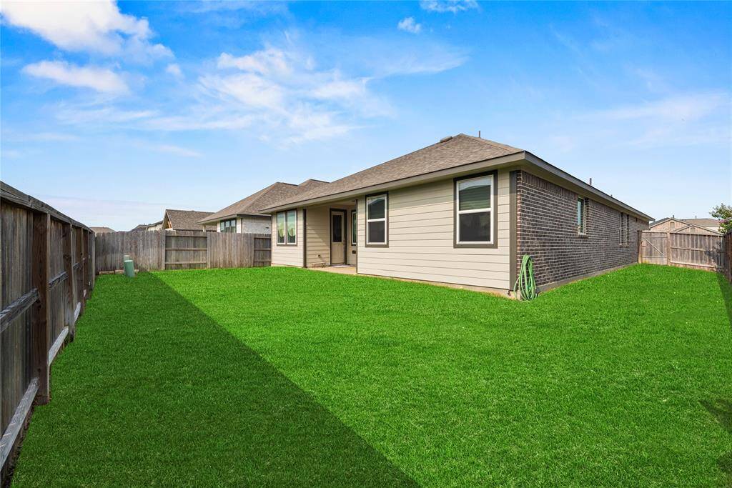 With a corner lot comes a larger yard. Enjoy hosting gatherings outside or watching the kids play in this wonderful backyard.