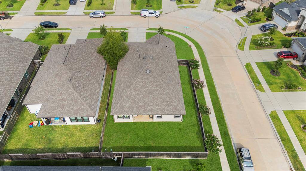 Aerial view of the back of the house showcasing only neighbors to the right and behind you.