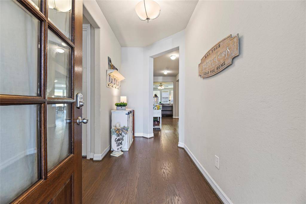 It will be love at first sight! Step through the 8' beautiful glass window paned door to discover elegant finishes in the home.