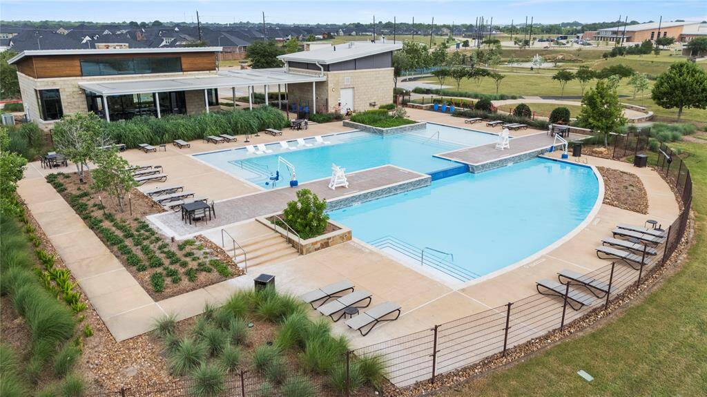 Cool off in the summer in this resort style pool with two levels and a tanning ledge!