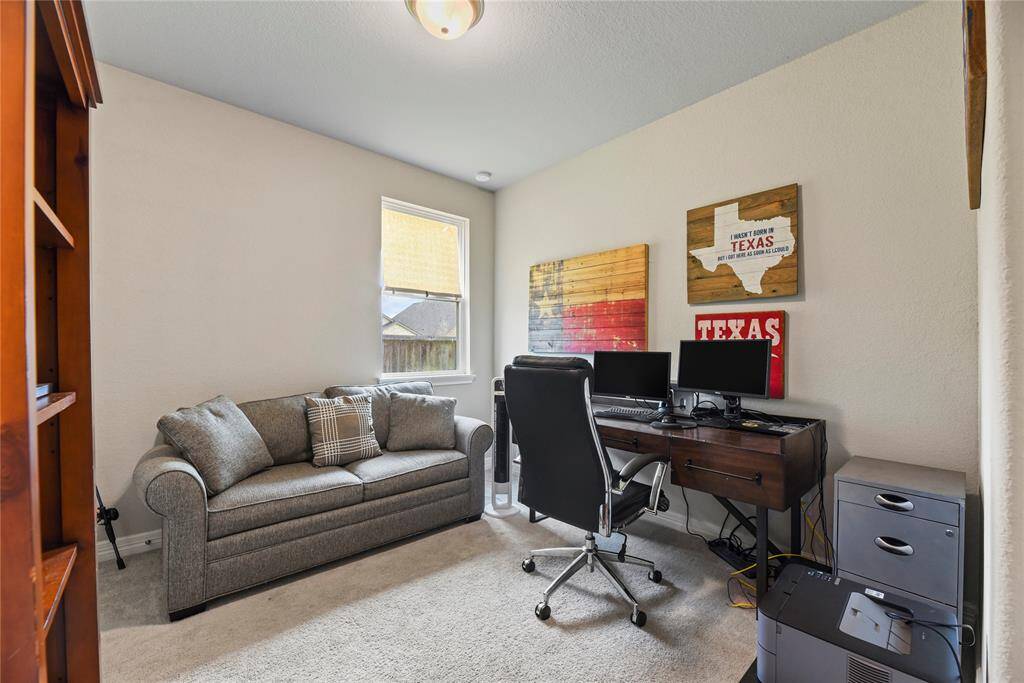 Across the front bedroom is the second bedroom with carpet and a wide closet.