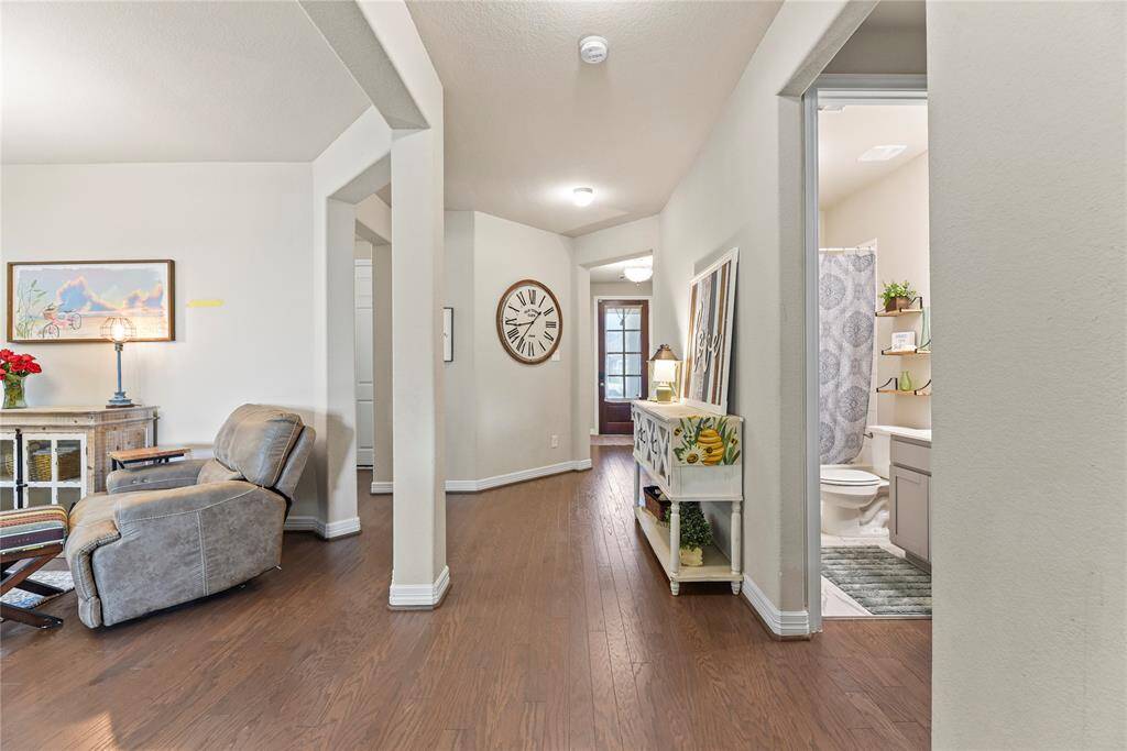 From the foyer and two bedrooms, you'll walk to the dining room and another guest bedroom and bathroom. Throughout the home are 9' ceilings and 8' doors.