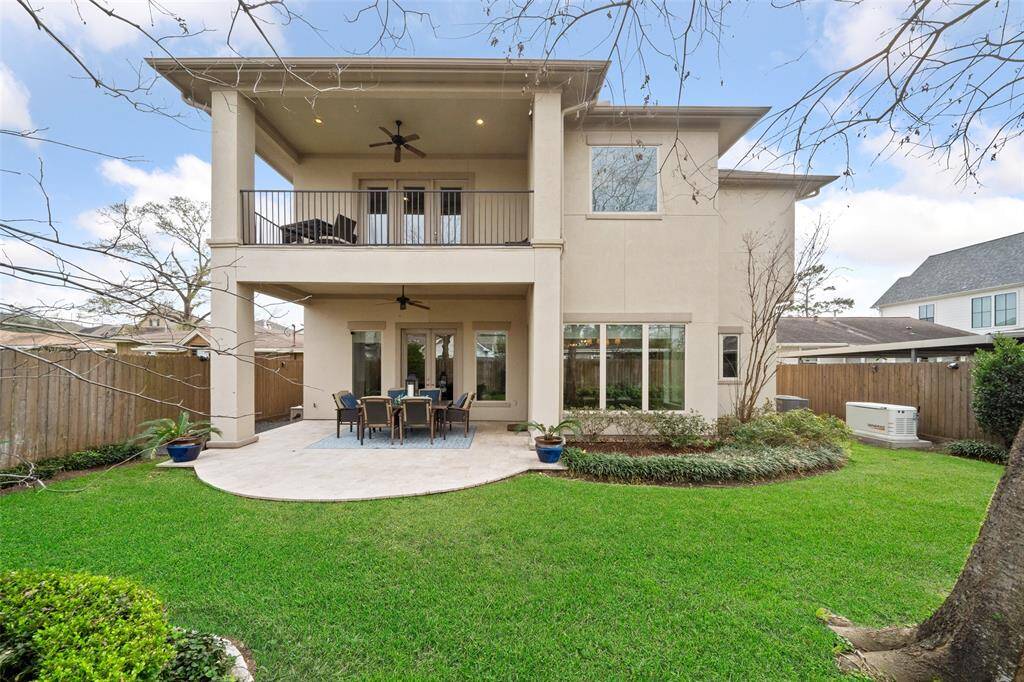 The back elevation of this home is to die for, featuring double verandas that provide stunning outdoor living spaces, all surrounded by mature landscaping for added privacy and charm. Plus, the generator conveys—ensuring you're always prepared. Hurricanes and ice storms are no match for this home!