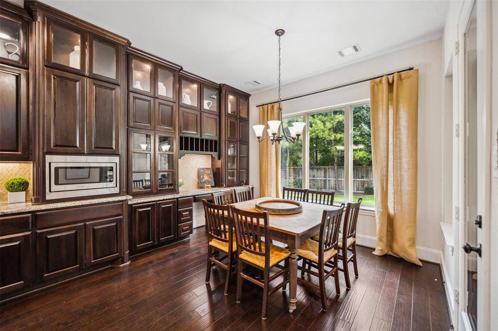 Large breakfast room has large window for lovely view of the backyard.