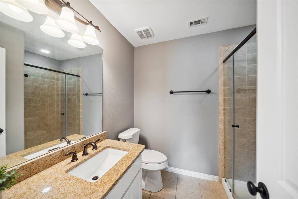 Ensuite bathroom with a stand-alone shower within the bedroom off of the Gameroom.