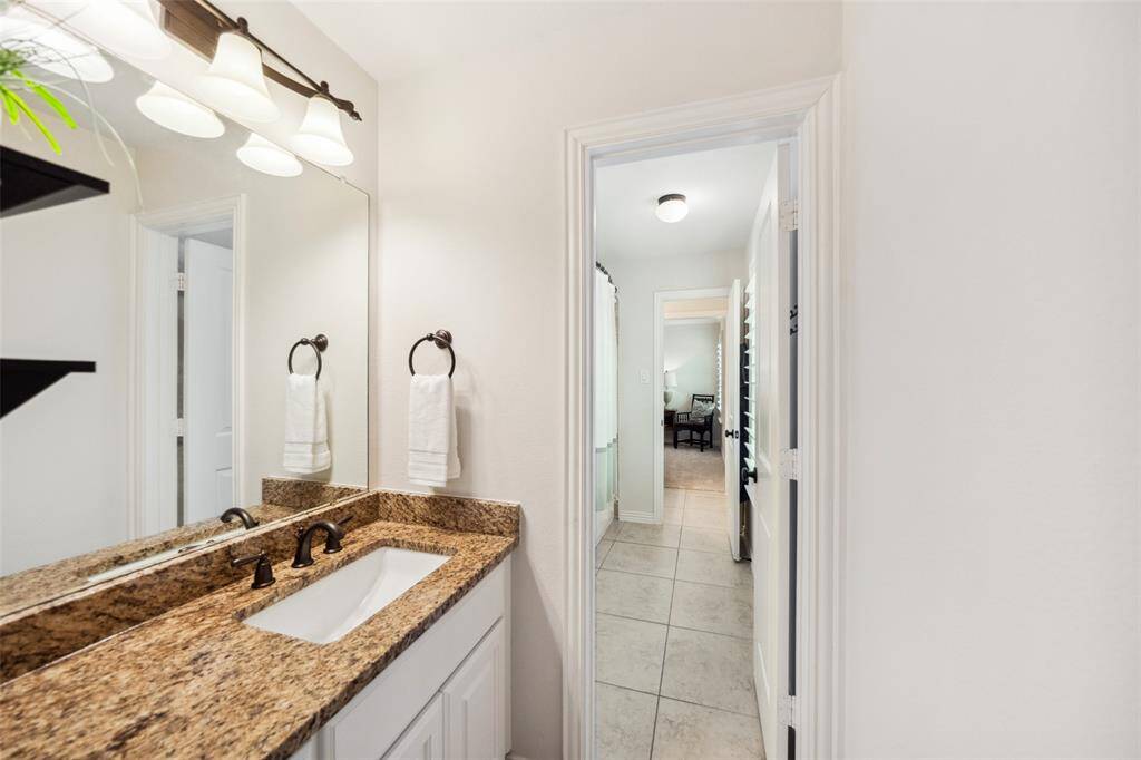 The 2nd vanity area of the Hollywood bath & entrance into the shared tub/shower area.