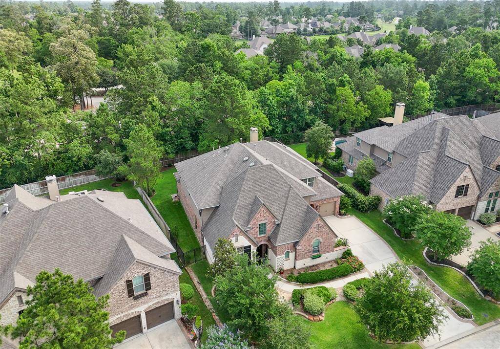 Stately executive home is situated amongst mature trees for privacy.