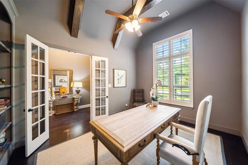 Spacious study accommodates large desk furniture effortlessly.