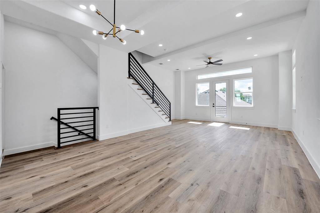 The open floor plan will allow ease of living and entertaining. The stairs lead to two bedrooms upstairs - the primary suite and a secondary bedroom with an ensuite bathroom.