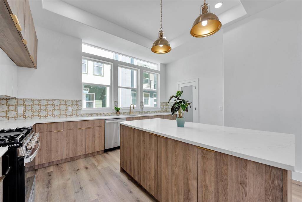 Beautiful custom cabinets provide lots of storage in this chef's kitchen. There is plenty of countertop space for prep. The expansive island is a wonderful place to gather around during family get togethers.