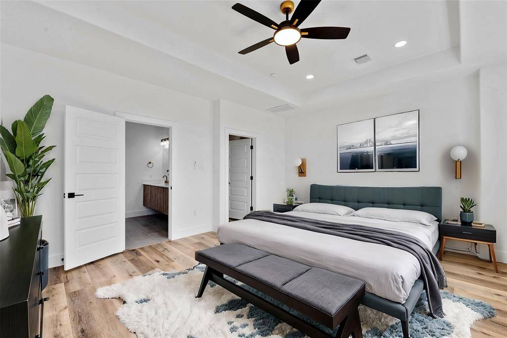 Step into this stunning owner’s suite, where sleek design meets ultimate comfort. Featuring soaring ceilings and expansive windows that flood the space with natural light, this suite is the epitome of luxury.