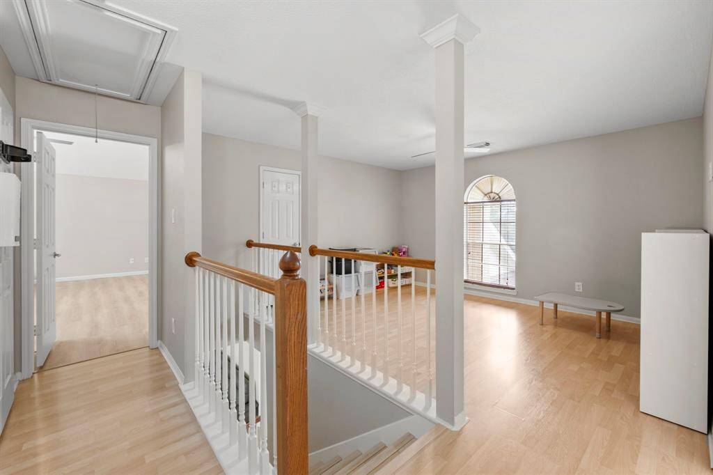 Second floor landing and view of the huge game room.