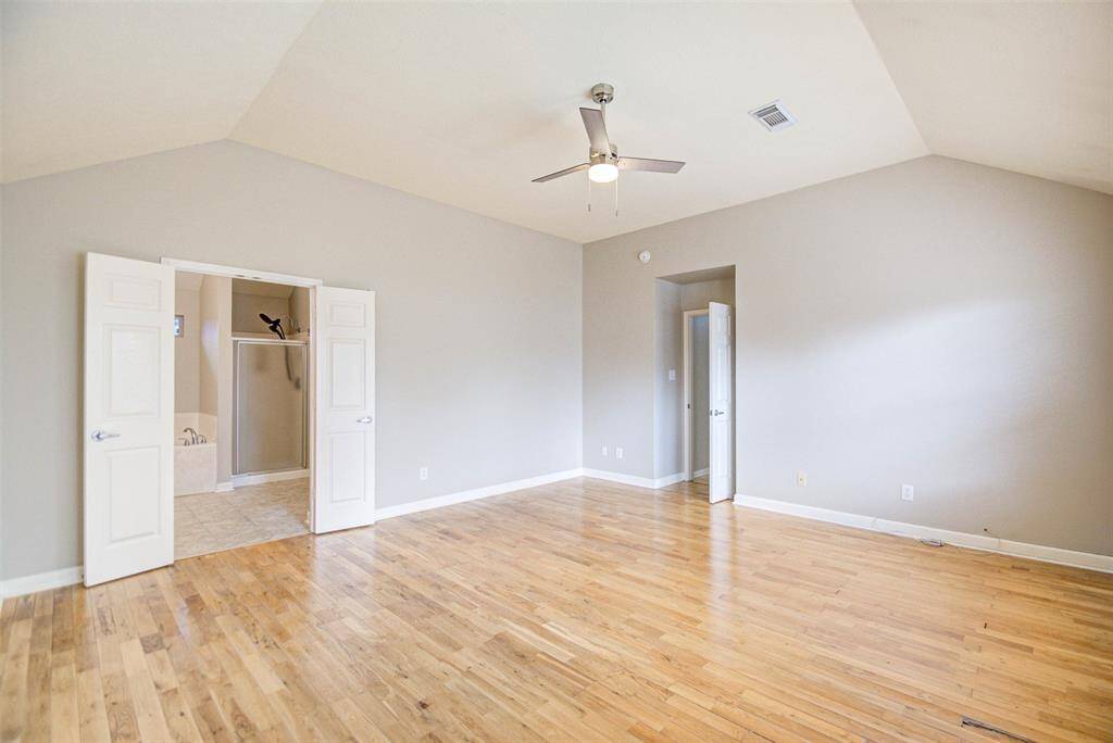 Another view of the primary bedroom.