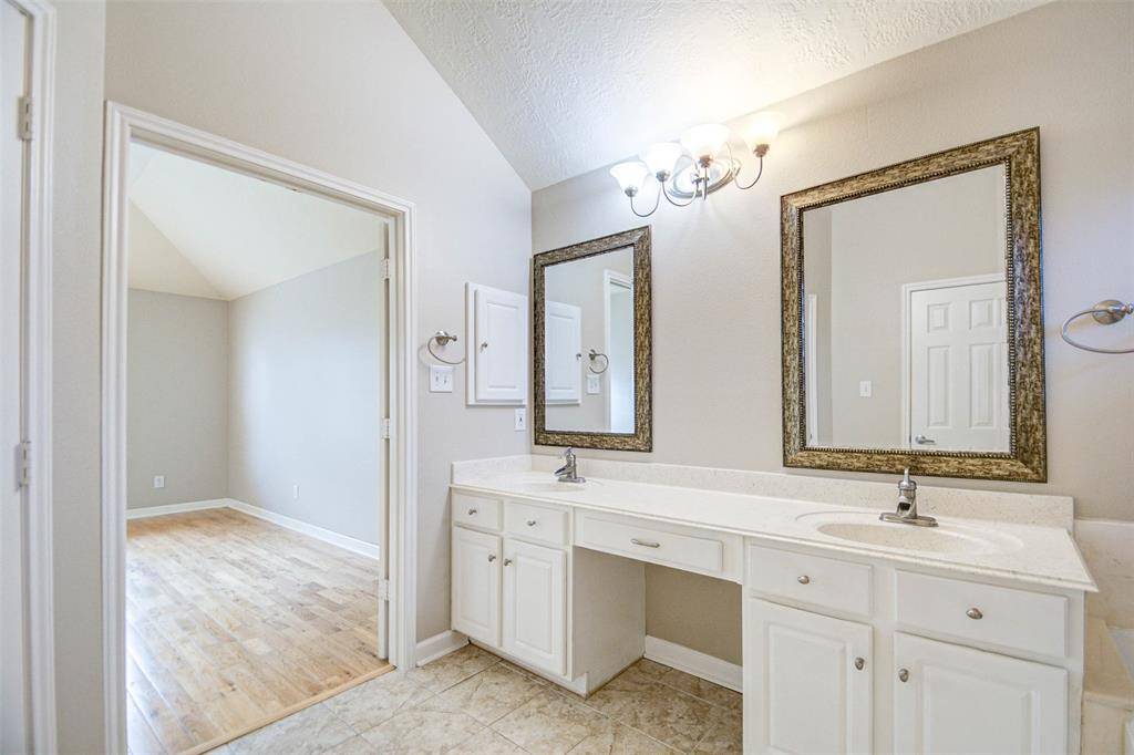 Primary bath, with dual vanities, and a makeup vanity.