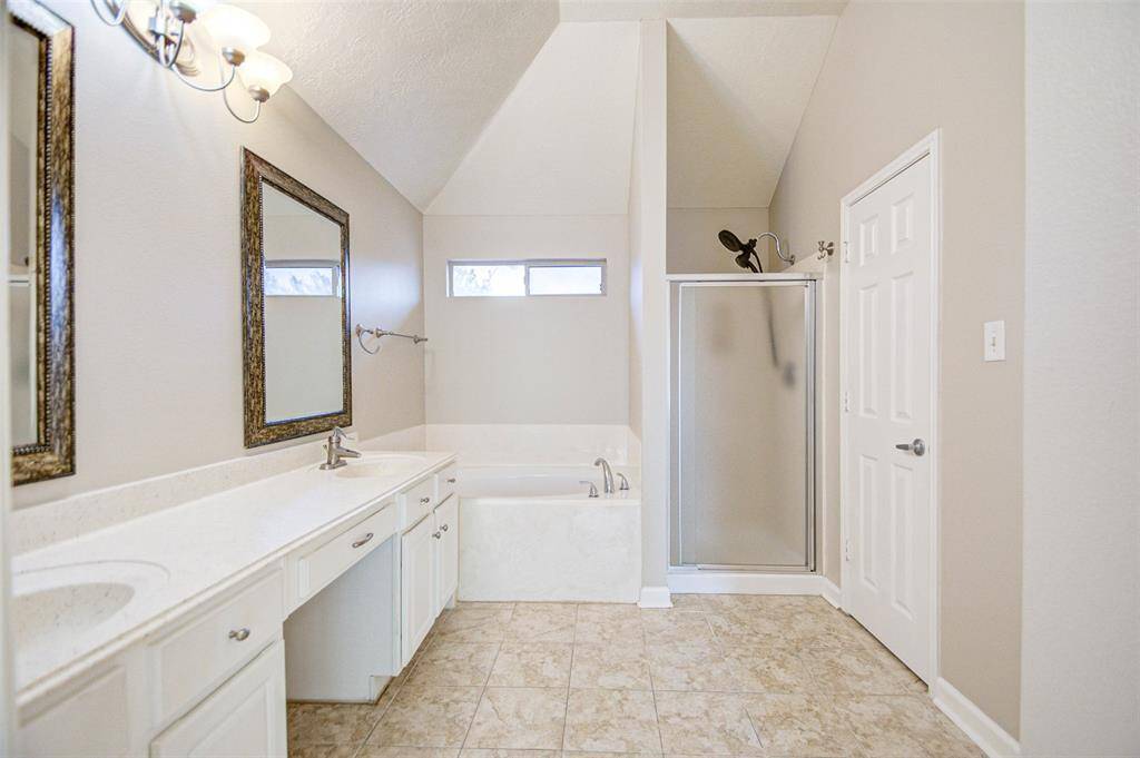 Separate shower and jetted spa.