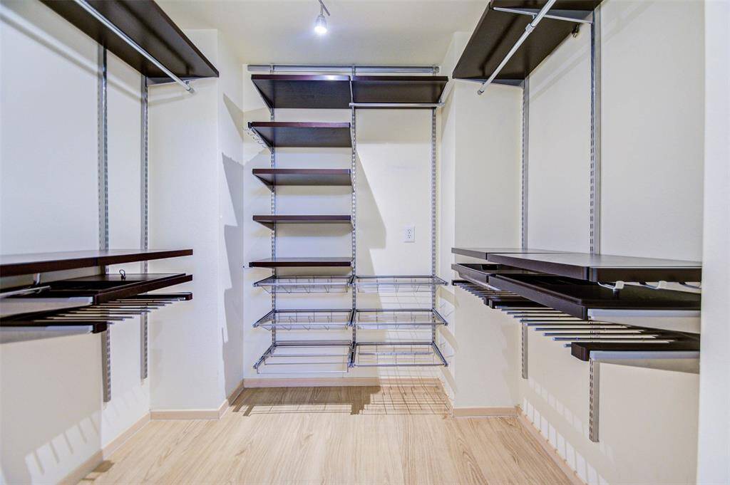 Walk in closet with elfa shelves.