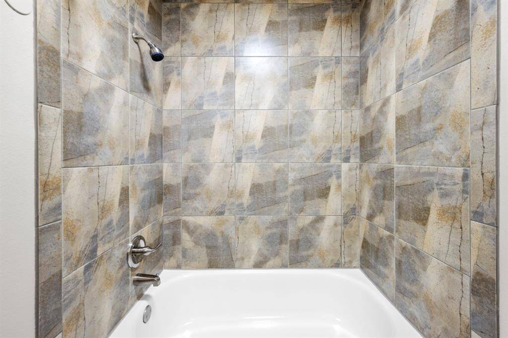 Combo tub and shower in bathroom number two.