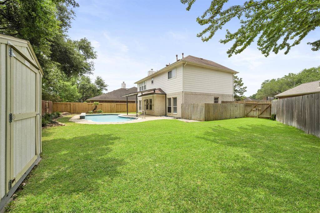 Even with a pool and a storage shed, there is plenty of room for the family to enjoy.