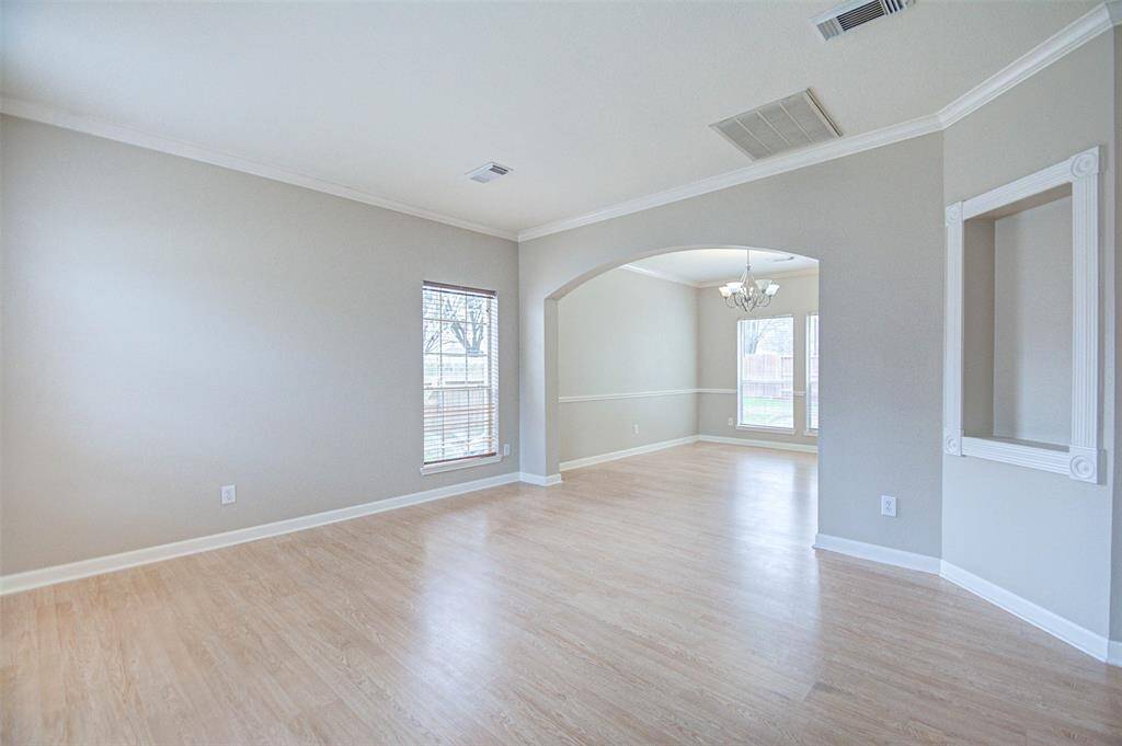 View of the formal living area with the formal dining room in the background.