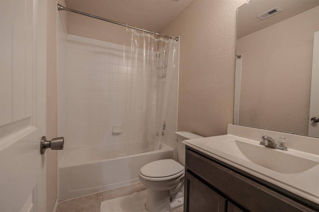 Neutral walls and a practical layout offer a functional space.