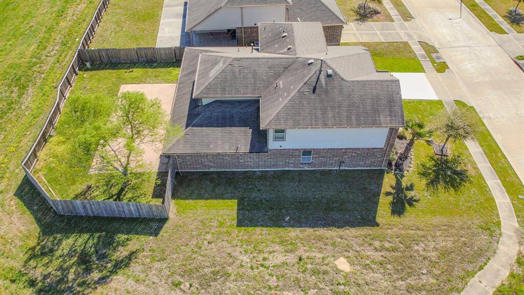 The property is situated on a corner lot in a well-maintained neighborhood, offering ample outdoor space and privacy.