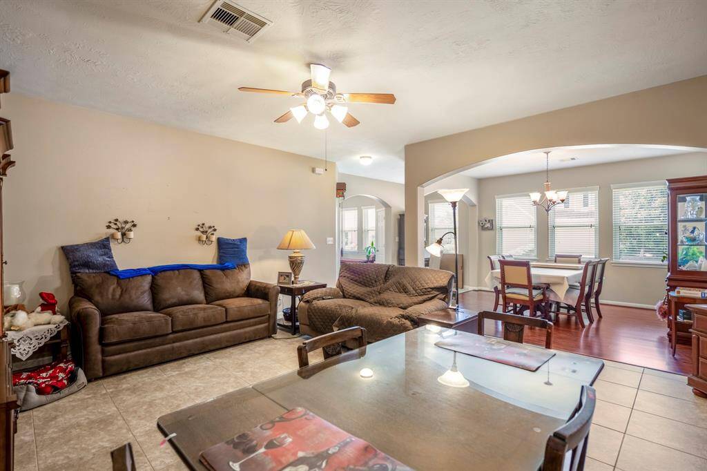 Enjoy a spacious living room area with lighted ceiling fan.