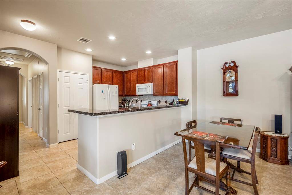 The island kitchen offers a pantry, a nice wood cabinetry.