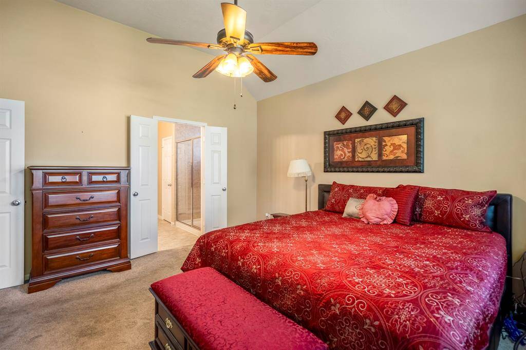 The primary bedroom suite has double doors that lead to the en-suite.