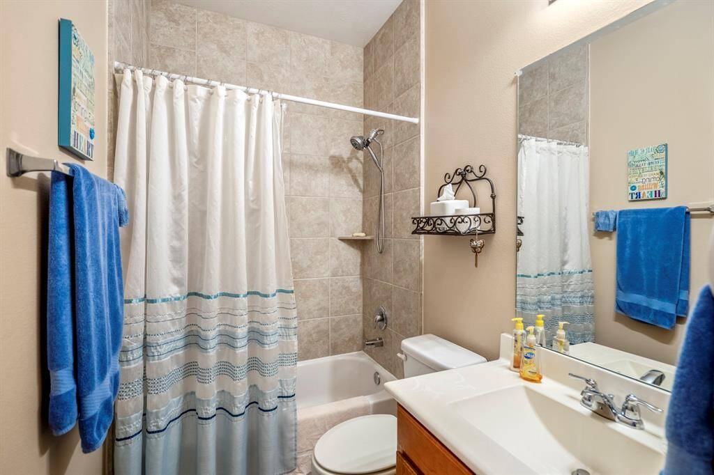 The second bathroom of the home offers a tub / shower combo.