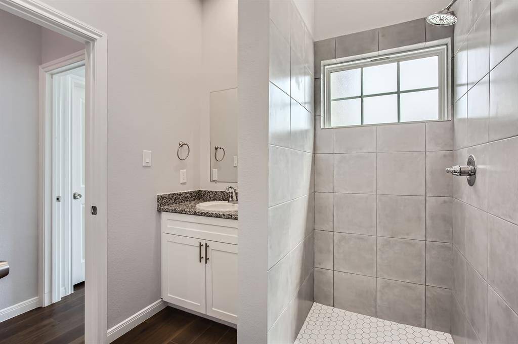 Secondary bathroom offers a large walk-in shower