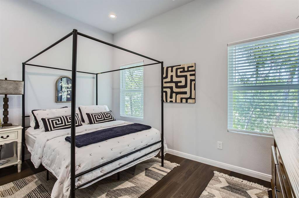 The primary bedroom has lots of natural light.