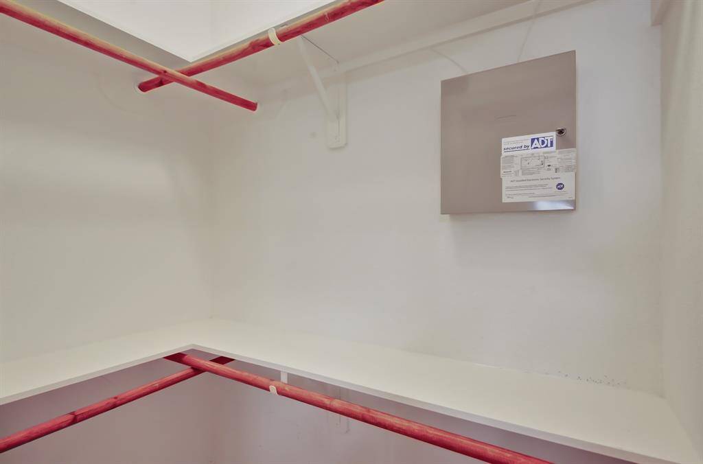 This spacious walk-in closet has room for all of your clothes, luggage, and seasonal gear.
