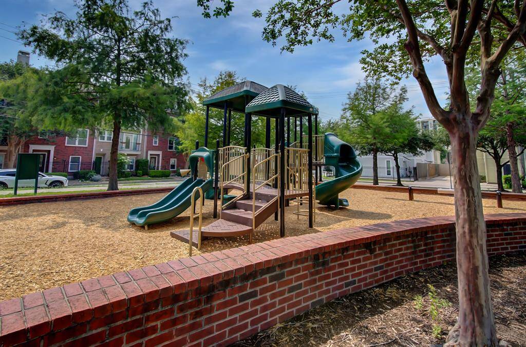 The neighborhood park features a playground and shaded green space.