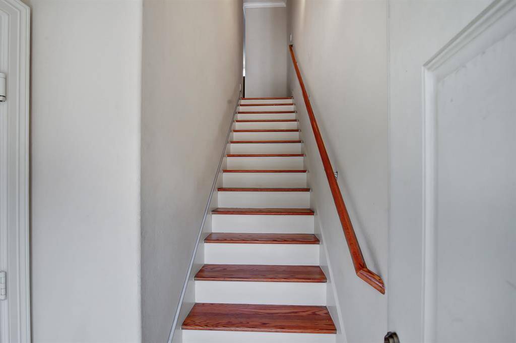 Come on in! To the left is the garage entrance, and upstairs is the common area. The house is set up with a Philips Hue Hub and smart thermostat.