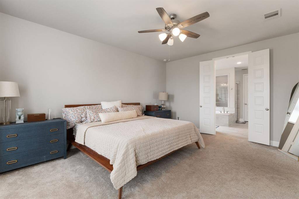 The spacious layout offers room for a sitting area or reading nook, while the private ensuite bathroom completes the retreat.