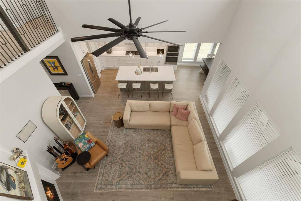 Enjoy a sweeping view of the family room and kitchen from above—a perspective that beautifully highlights the home's wide open floorplan.
