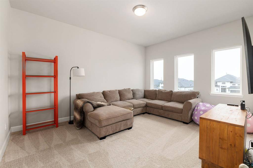 Located just off the game room and tucked behind elegant double doors, this flexible bonus room offers endless possibilities. Whether you envision it as a cozy media room, a quiet reading nook, or a creative studio, this space provides the privacy and versatility to suit your lifestyle.