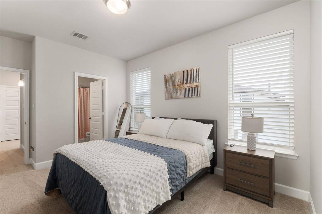 Perfect for family or guests, this room also includes its own private ensuite bathroom and a spacious walk-in closet—providing both comfort and convenience.