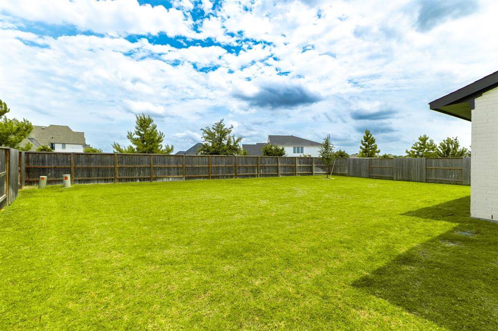 The oversized backyard provides a blank canvas, ready for you to create your dream outdoor retreat.
